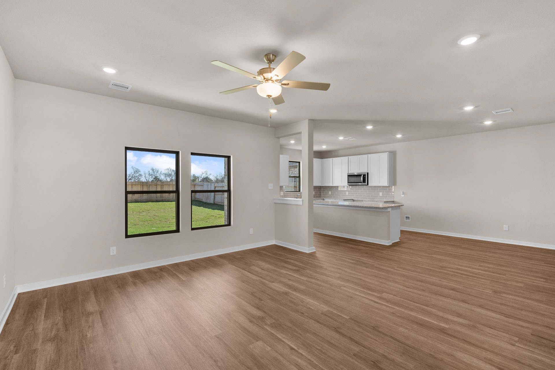 13319 Prado Rdg Lane Rosharon, TX 77583 - Photo 7 of 33 a view of an empty room with window and wooden floor