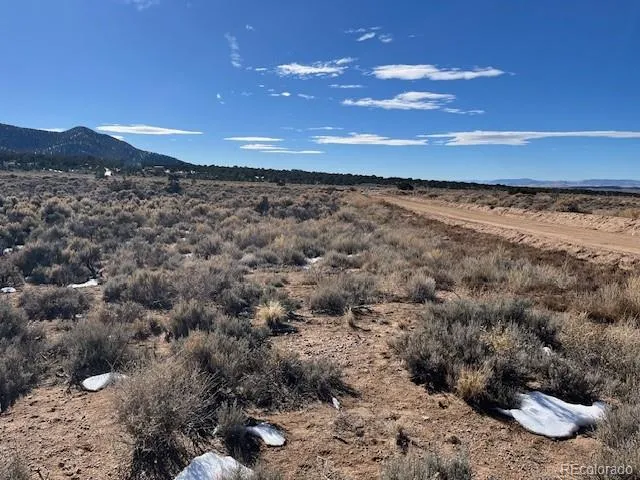 a view of an outdoor space and a mountain