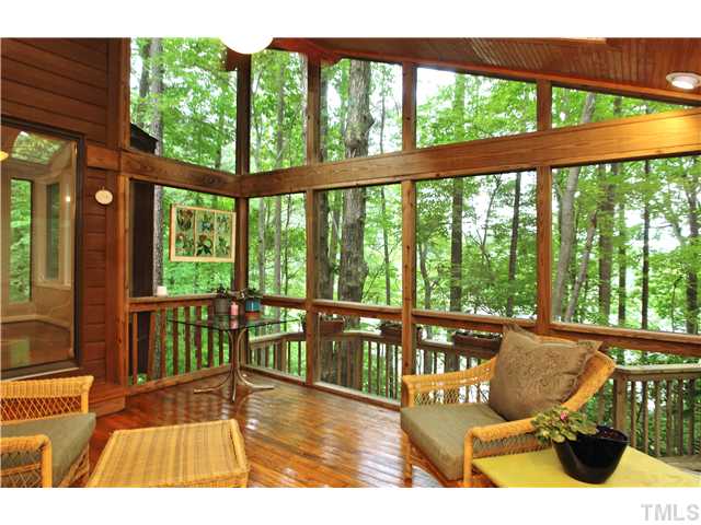6215 Lookout Loop Raleigh, NC 27612 - Photo 3 of 25 a balcony with furniture and wooden floor
