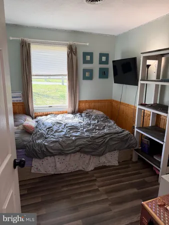 a bedroom with a bed and furniture
