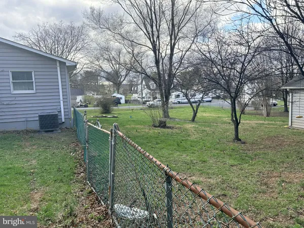 a view of a backyard with green space