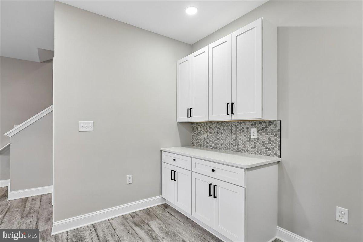 8737 Autumn Ridge Court Odenton, MD 21113 - Photo 16 of 46 a view of cabinets with wooden floor