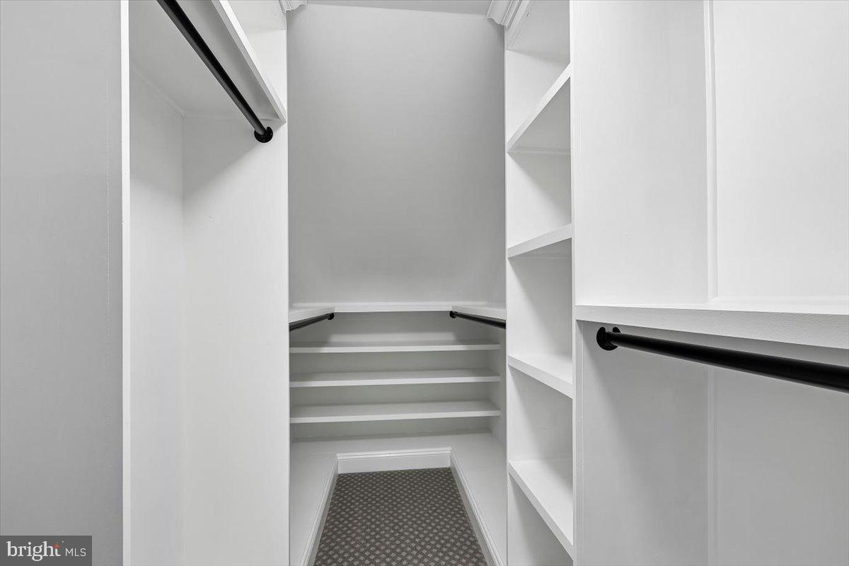 8737 Autumn Ridge Court Odenton, MD 21113 - Photo 19 of 46 a view of staircase with white walls and a window