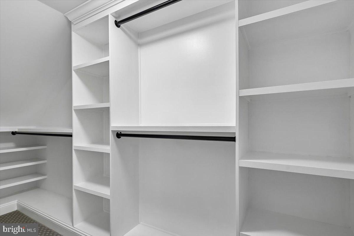 8737 Autumn Ridge Court Odenton, MD 21113 - Photo 20 of 46 a view of walk in closet with empty racks