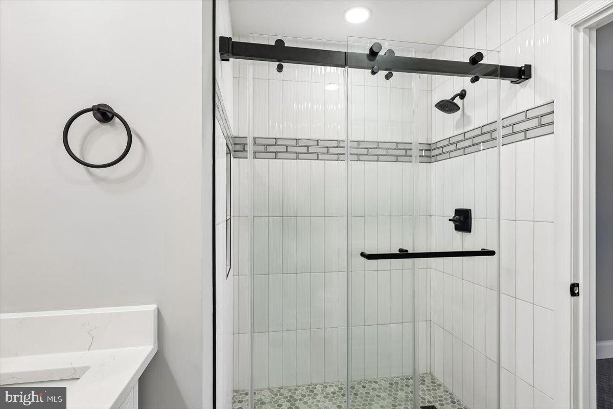 8737 Autumn Ridge Court Odenton, MD 21113 - Photo 21 of 46 a bathroom with a shower