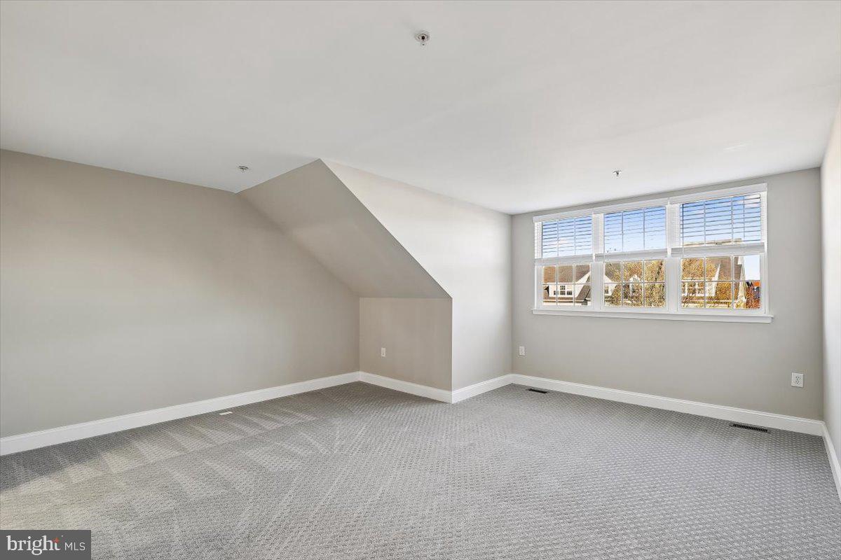 8737 Autumn Ridge Court Odenton, MD 21113 - Photo 27 of 46 a view of an empty room with a window
