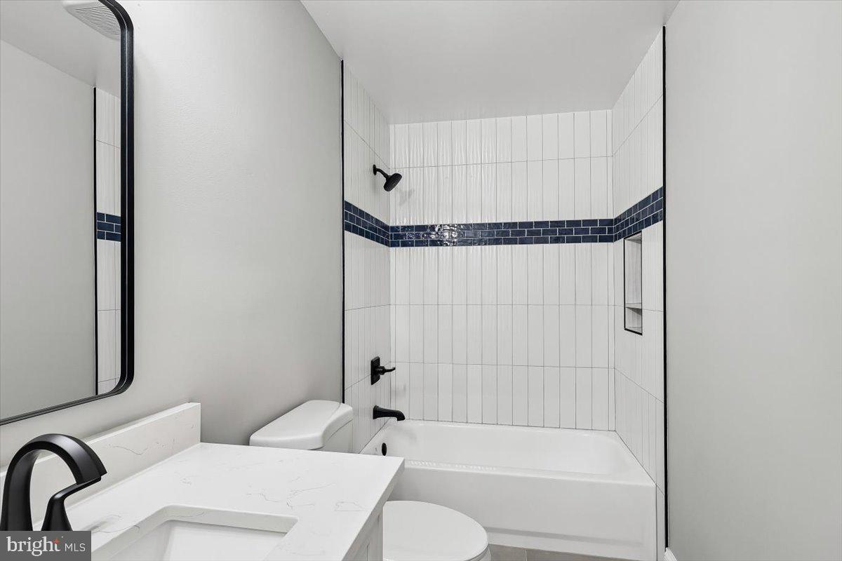 8737 Autumn Ridge Court Odenton, MD 21113 - Photo 28 of 46 a bathroom with a toilet and a bathtub