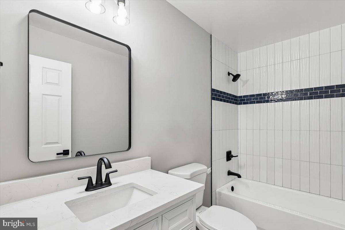 8737 Autumn Ridge Court Odenton, MD 21113 - Photo 29 of 46 a bathroom with a sink and a mirror