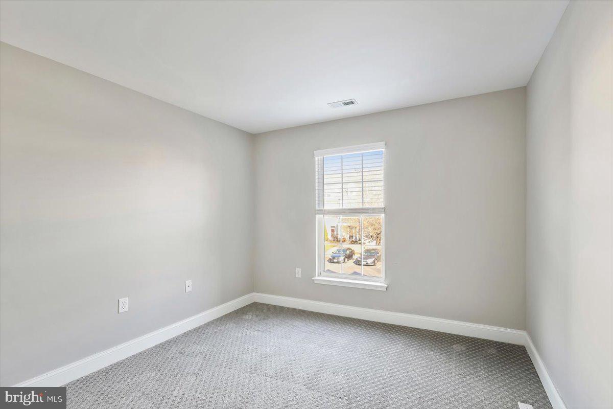 8737 Autumn Ridge Court Odenton, MD 21113 - Photo 32 of 46 an empty room with windows
