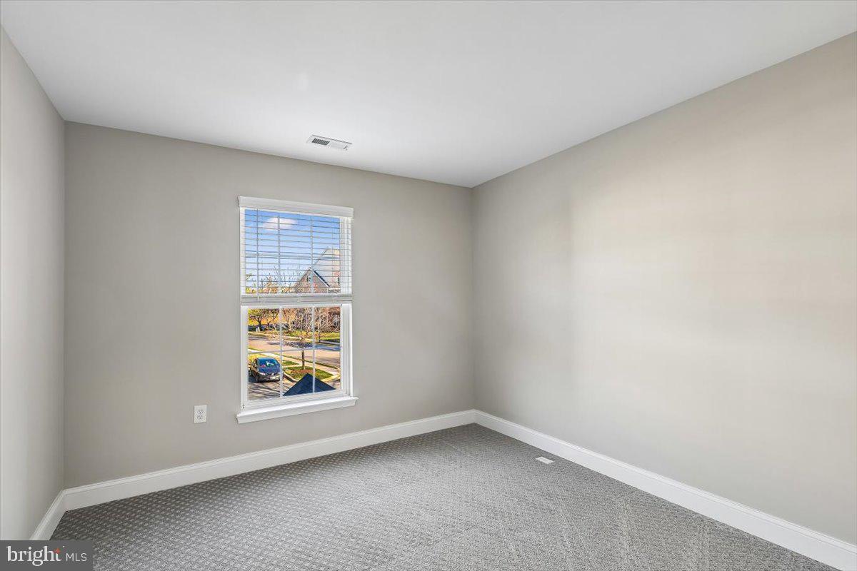 8737 Autumn Ridge Court Odenton, MD 21113 - Photo 37 of 46 an empty room with windows