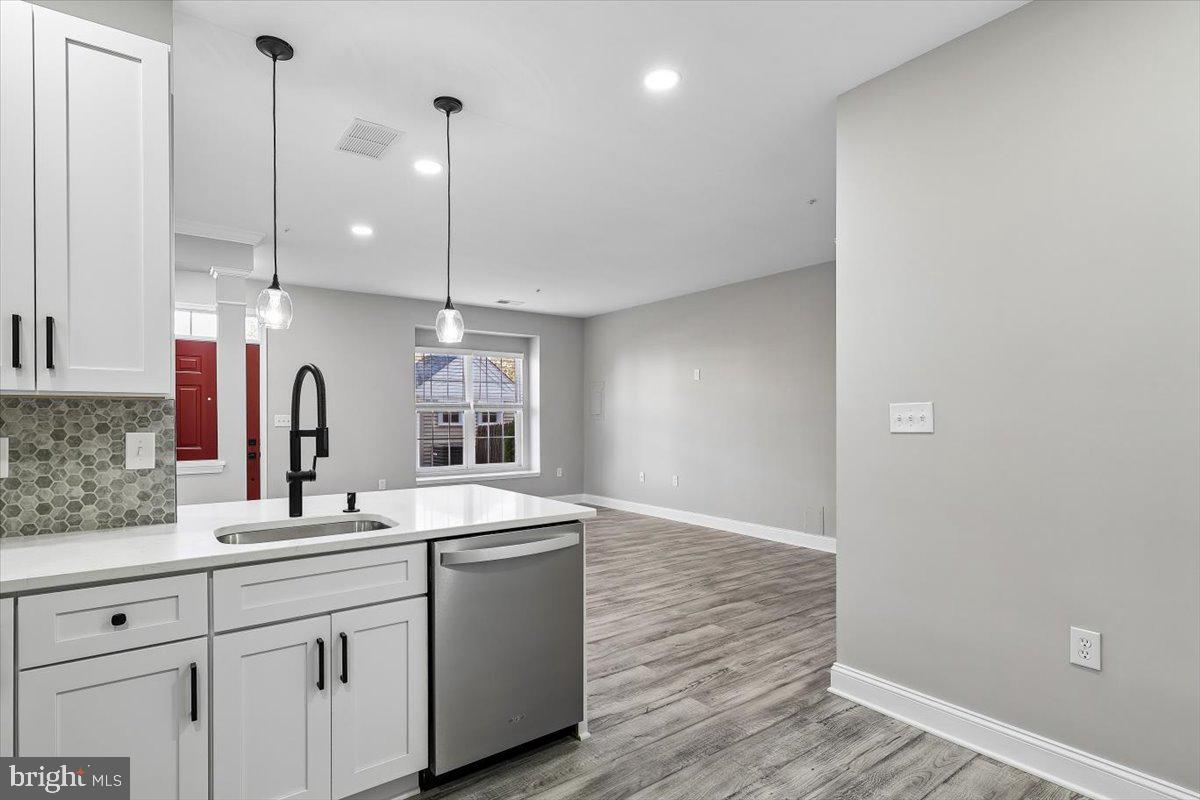 8737 Autumn Ridge Court Odenton, MD 21113 - Photo 5 of 46 a bathroom with a sink and a mirror