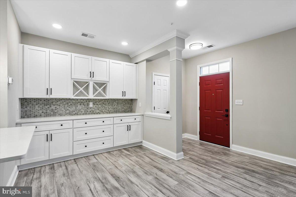 8737 Autumn Ridge Court Odenton, MD 21113 - Photo 8 of 46 a kitchen with stainless steel appliances granite countertop a stove and a refrigerator