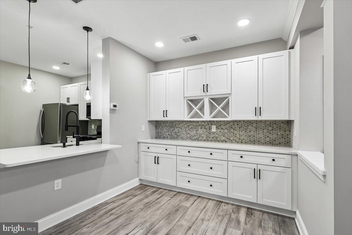 8737 Autumn Ridge Court Odenton, MD 21113 - Photo 9 of 46 a bathroom with a granite countertop sink and a mirror