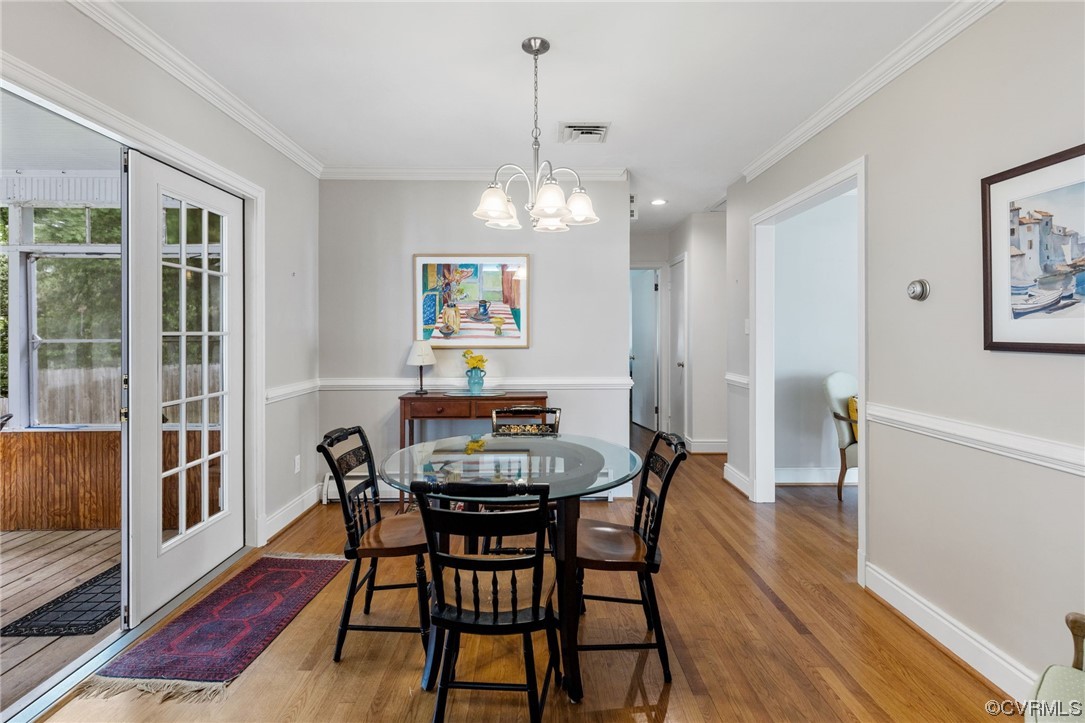 9505 Newhall Road Henrico, VA 23229 - Photo 11 of 33 a view of a dining room with furniture wooden floor and a chandelier
