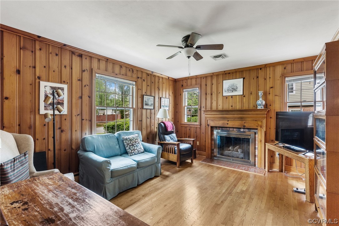 9505 Newhall Road Henrico, VA 23229 - Photo 14 of 33 a living room with furniture a flat screen tv and a fireplace