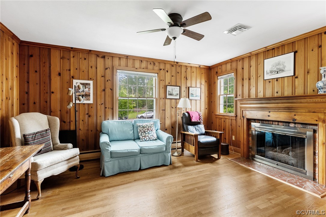 9505 Newhall Road Henrico, VA 23229 - Photo 18 of 33 a living room with furniture ceiling fan and a fireplace
