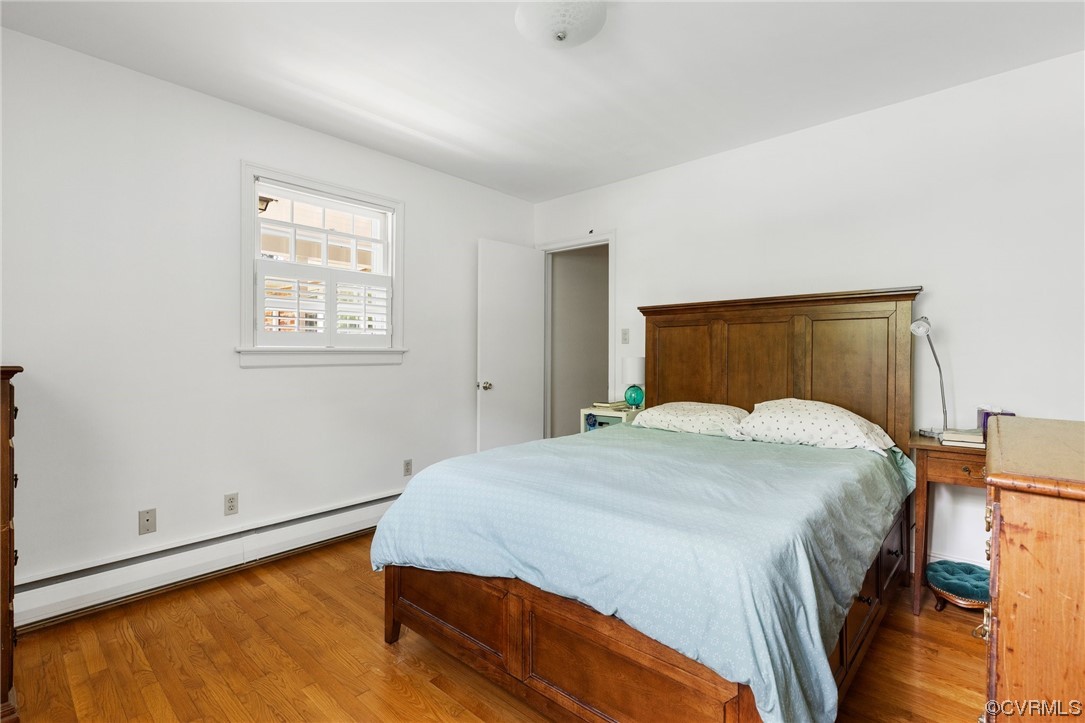 9505 Newhall Road Henrico, VA 23229 - Photo 19 of 33 a bedroom with a bed and wooden floor