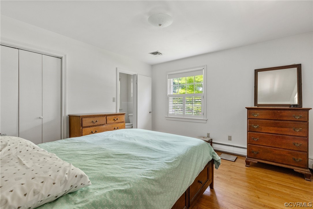 9505 Newhall Road Henrico, VA 23229 - Photo 20 of 33 a bedroom with a bed and a dresser