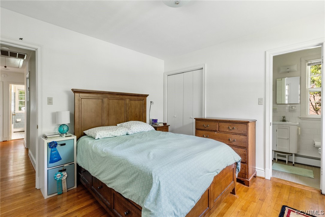 9505 Newhall Road Henrico, VA 23229 - Photo 21 of 33 a bedroom with a bed and wooden floor