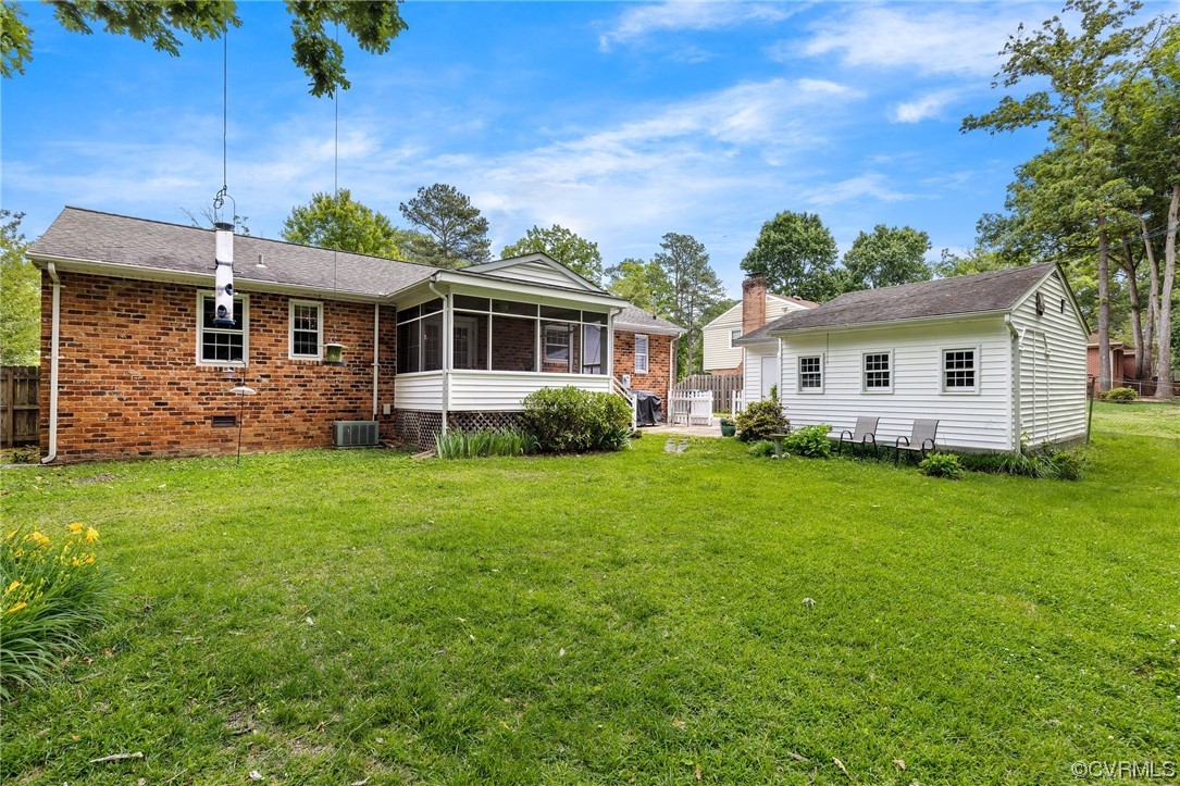 9505 Newhall Road Henrico, VA 23229 - Photo 29 of 33 a front view of a house with a garden