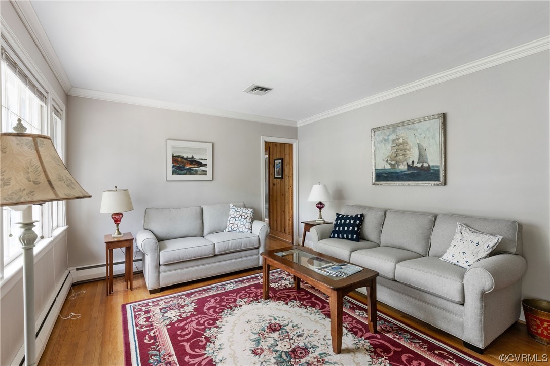9505 Newhall Road Henrico, VA 23229 - Photo 5 of 33 a living room with furniture a rug and a table