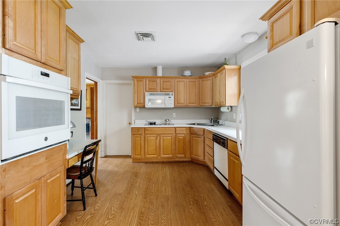 9505 Newhall Road Henrico, VA 23229 - Photo 8 of 33 a kitchen with a sink cabinets stainless steel appliances and a window