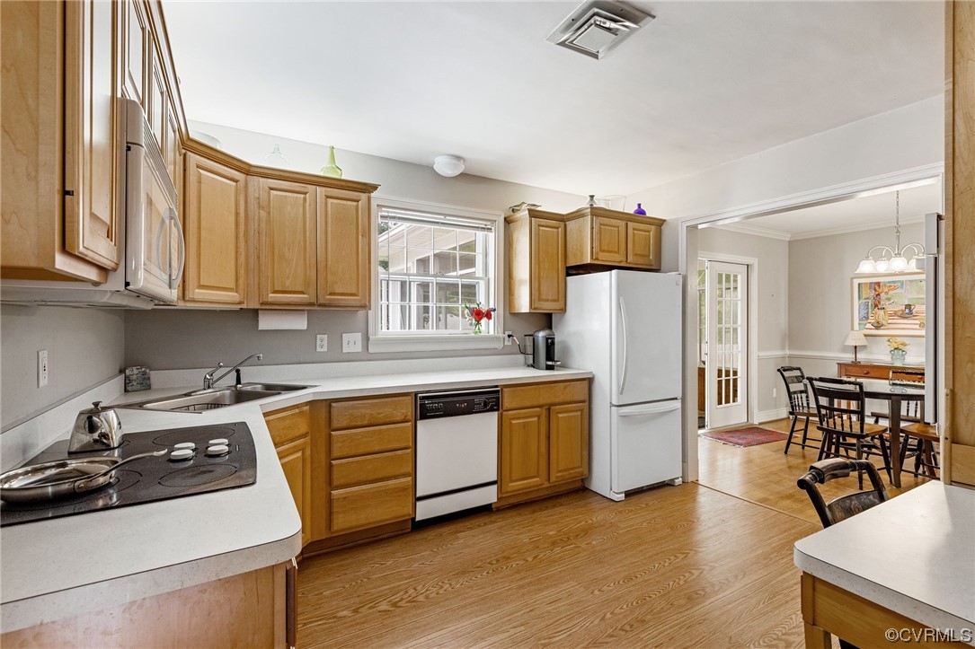 9505 Newhall Road Henrico, VA 23229 - Photo 9 of 33 a kitchen with stainless steel appliances granite countertop a stove a sink dishwasher and a refrigerator with wooden floor