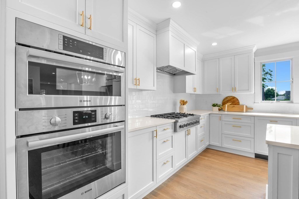 47 Glendale Road Marblehead, MA 01945 - Photo 11 of 33 a kitchen with stainless steel appliances granite countertop a stove and cabinets