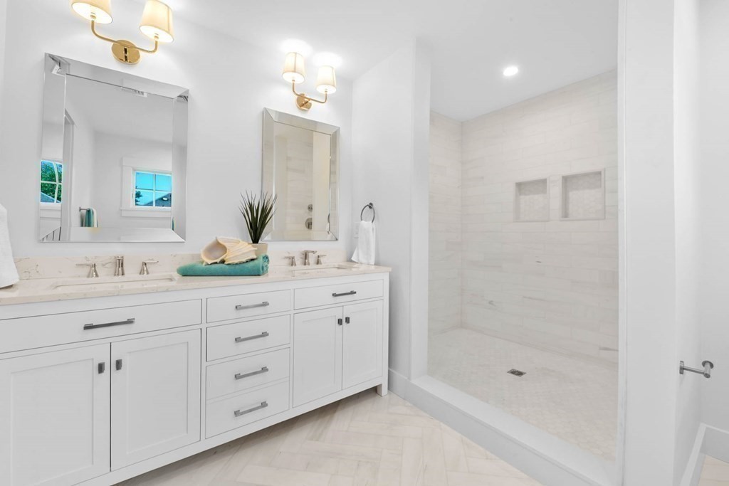 47 Glendale Road Marblehead, MA 01945 - Photo 22 of 33 a bathroom with a shower sink and mirror