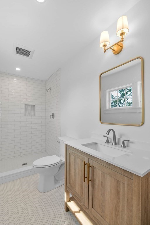 47 Glendale Road Marblehead, MA 01945 - Photo 25 of 33 a bathroom with a granite countertop sink a toilet and a bathtub