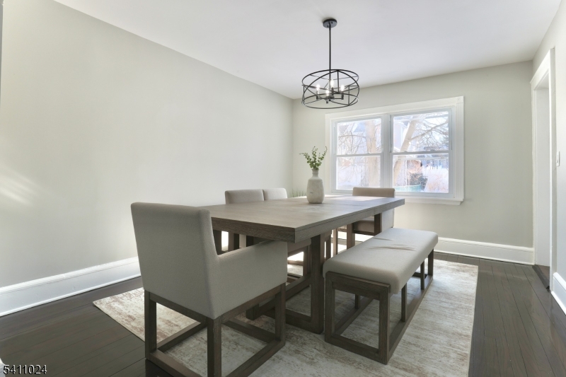 401 Burroughs Terrace Union, NJ 07083 - Photo 14 of 36 a view of a dining room with furniture window and wooden floor