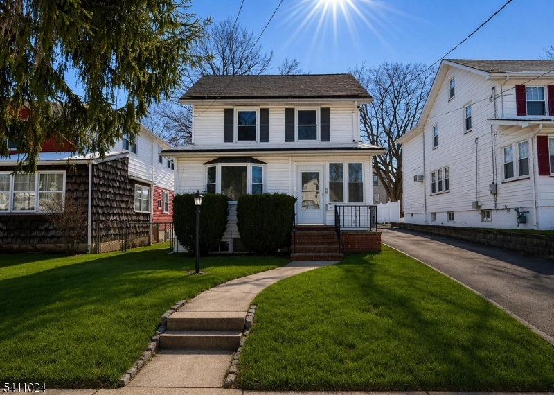 401 Burroughs Terrace Union, NJ 07083 - Photo 2 of 36 a front view of a house with a yard