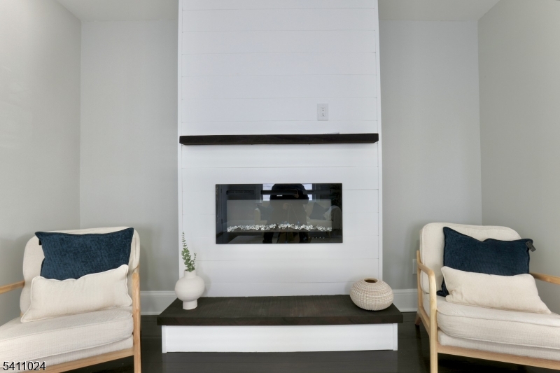 401 Burroughs Terrace Union, NJ 07083 - Photo 10 of 36 a living room with furniture and a fireplace