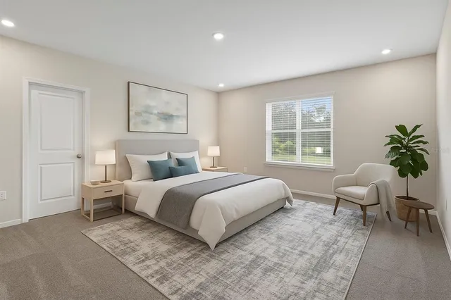 a bedroom with a bed and a window