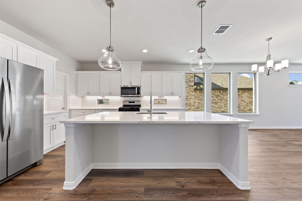 1844 Rosedale Avenue Van Alstyne, TX 75495 - Photo 6 of 26 The oversized island is the hub of your new dream kitchen and the perfect place for friends and family to gahter!