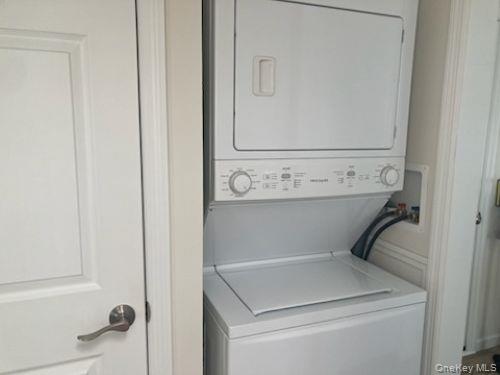 1661 Old Country Road, Unit 49 Riverhead, NY 11901 - Photo 11 of 11 a utility room with dryer and washer