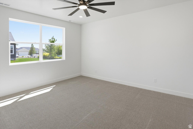 1315 West 3200 South, Unit 17 Perry, UT 84302 - Photo 28 of 58 Expansive window offering abundant illumination, recessed lighting, and a contemporary ceiling fan