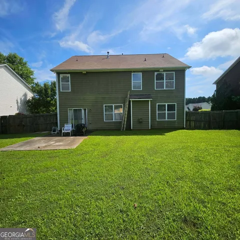 a house view with a garden space