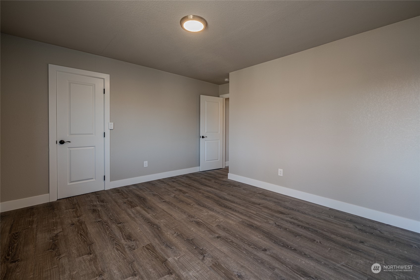 3125 Conarty Road Malaga, WA 98828 - Photo 25 of 37 a view of an empty room with wooden floor