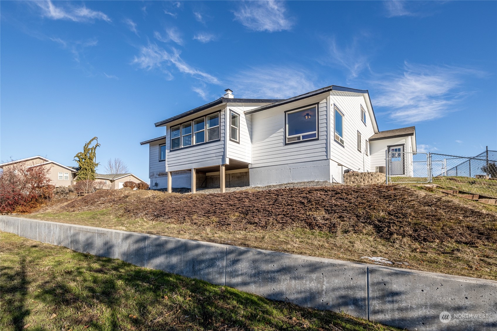 3125 Conarty Road Malaga, WA 98828 - Photo 30 of 37 a front view of a house with a yard