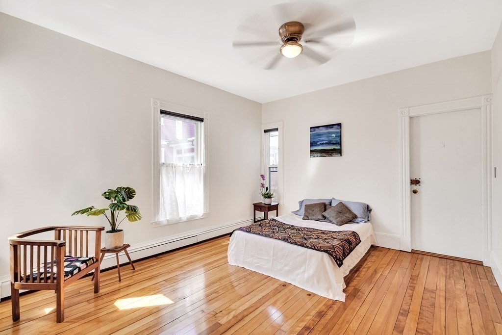 12 Rindge Avenue, Unit 2 Cambridge, MA 02140 - Photo 12 of 25 a spacious bedroom with a bed and a window