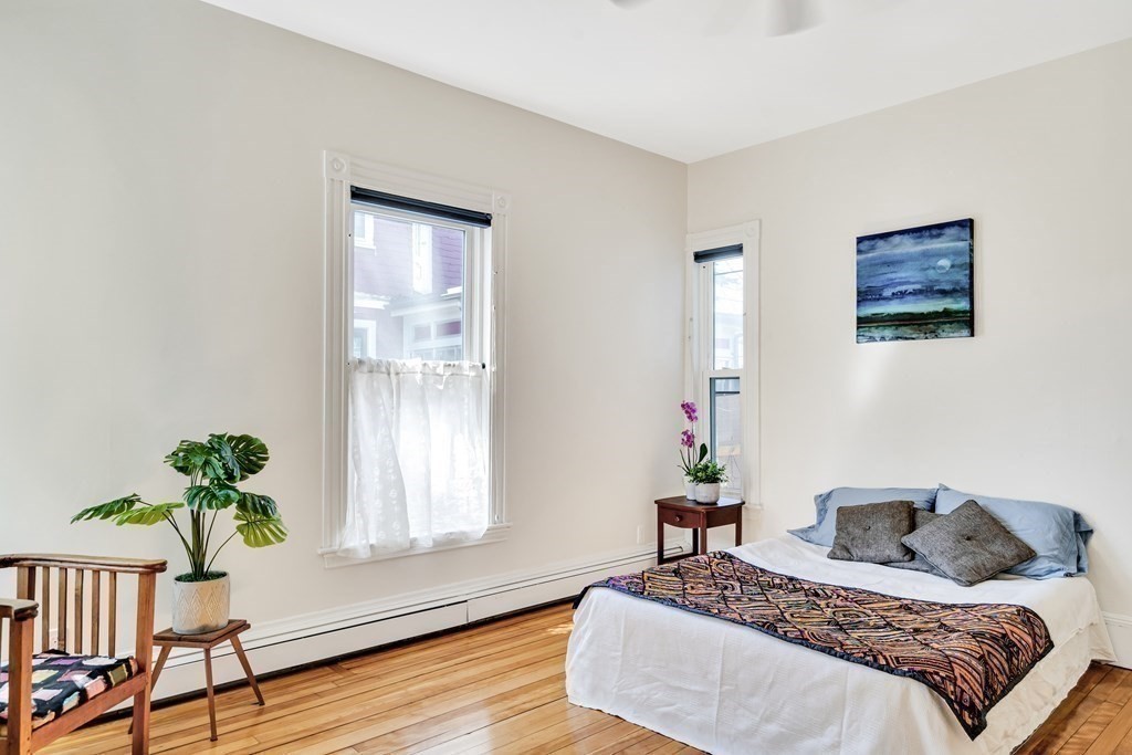 12 Rindge Avenue, Unit 2 Cambridge, MA 02140 - Photo 14 of 25 a bedroom with a bed and a window