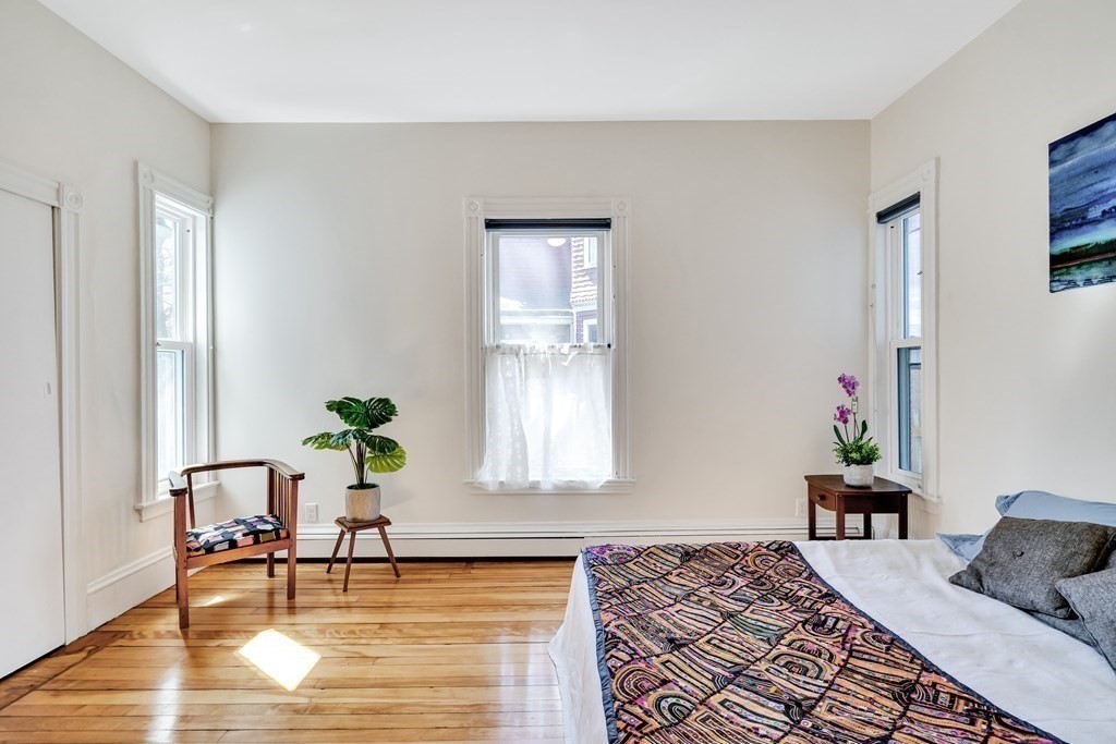 12 Rindge Avenue, Unit 2 Cambridge, MA 02140 - Photo 15 of 25 a bedroom with furniture and a window
