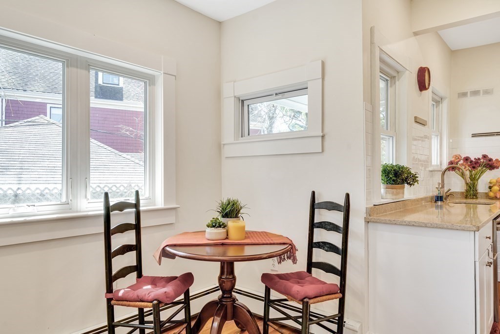 12 Rindge Avenue, Unit 2 Cambridge, MA 02140 - Photo 7 of 25 a view of a dining room with furniture and window