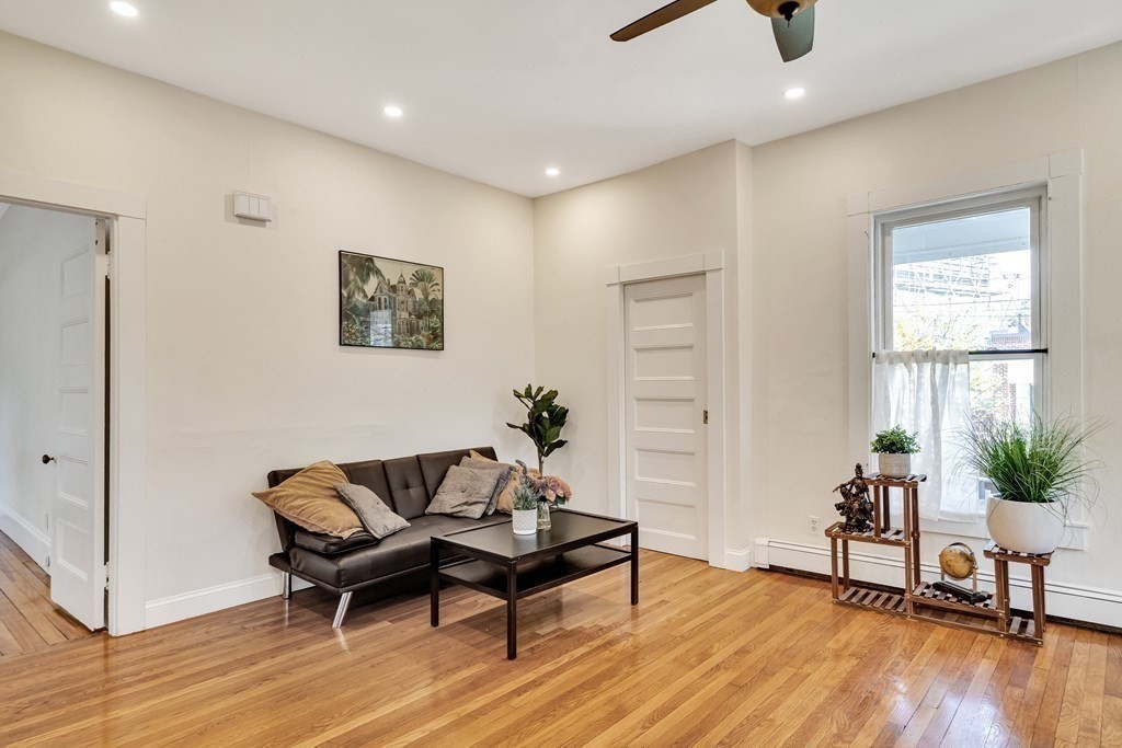 12 Rindge Avenue, Unit 2 Cambridge, MA 02140 - Photo 10 of 25 a living room with furniture and a potted plant