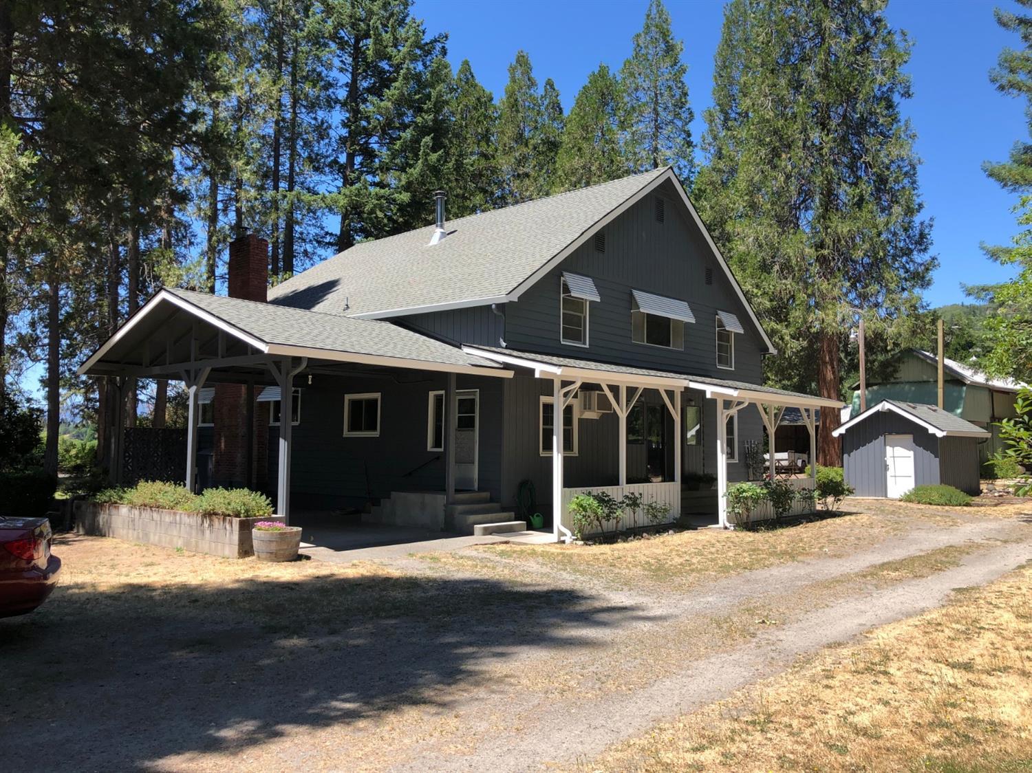 2368 Upper River Road Grants Pass, OR 97526 - Photo 16 of 30 a front view of a house with a yard and garage