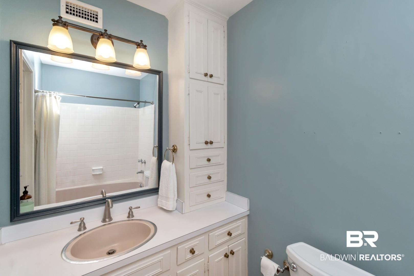 3755 Claridge Road North Mobile, AL 36608 - Photo 18 of 38 Bathroom with toilet, vanity, and shower / bathtub combination with curtain