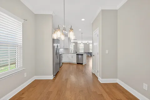 a view of a kitchen with wooden floor