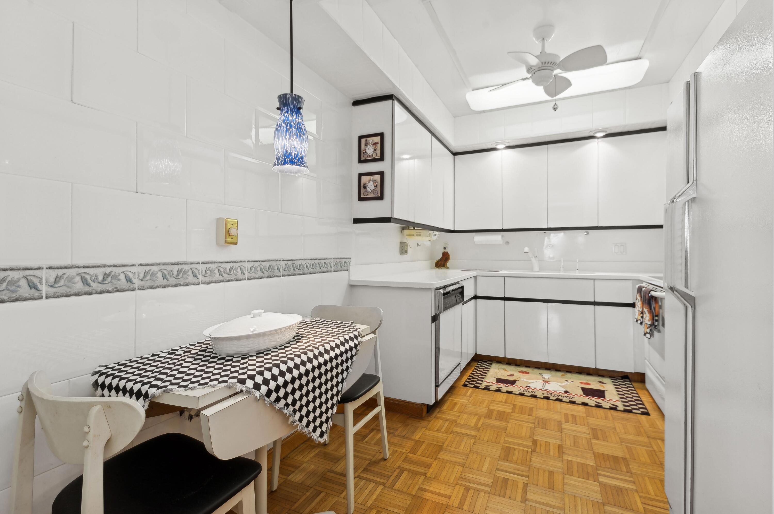 50 E Road, Unit 11F Delray Beach, FL 33483 - Photo 14 of 31 a bathroom with a sink a mirror and a bathtub