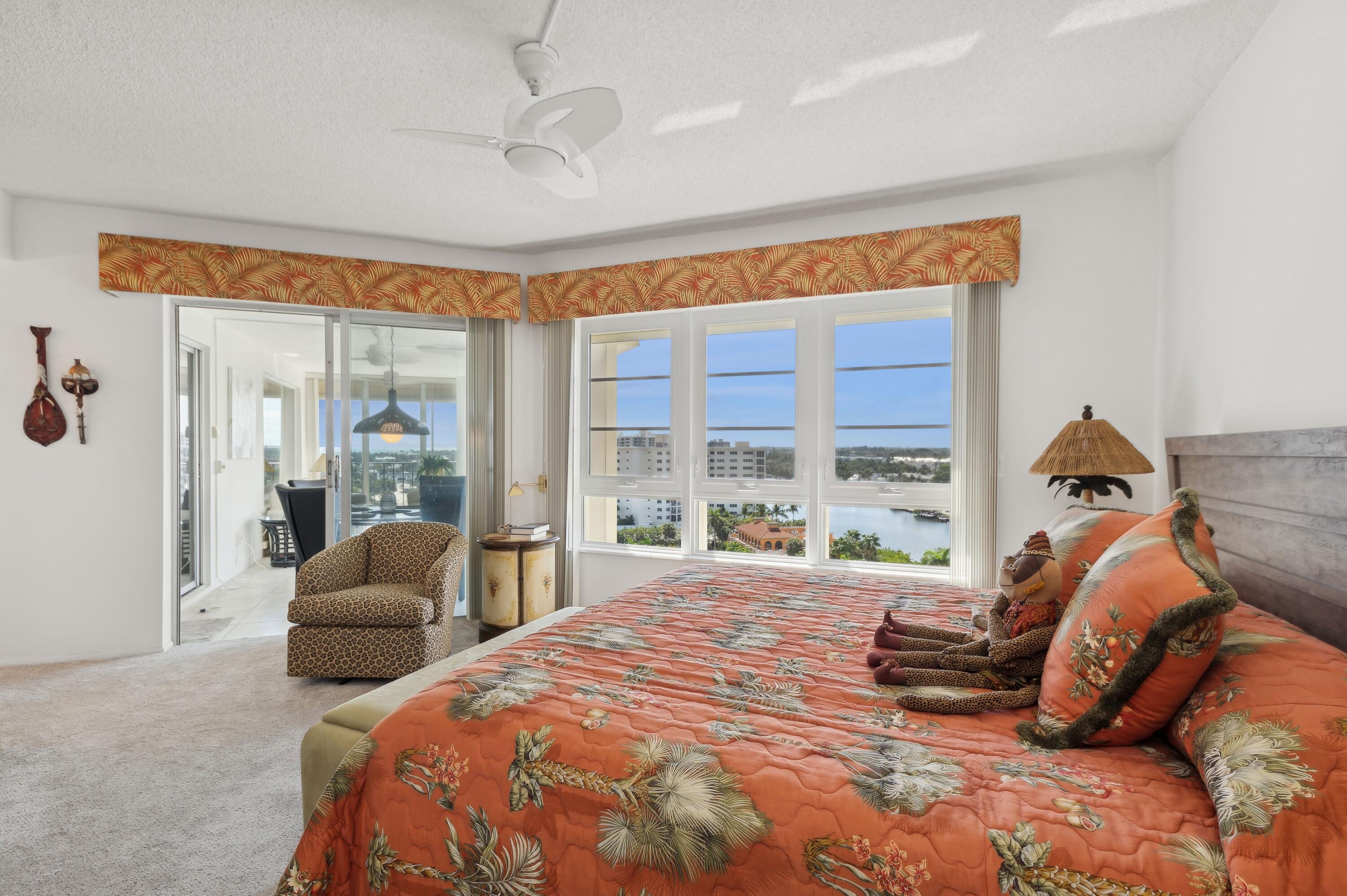 50 E Road, Unit 11F Delray Beach, FL 33483 - Photo 17 of 31 a bedroom with a bed and glass windows